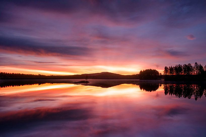 Sunrise behind a Swedish lake